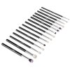 Set of black-handled makeup brushes on white background