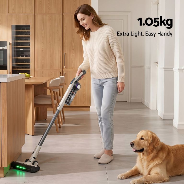 devanti cordless vacuum cleaner with auto empty dust station, 18kpa powerful suction 1.05kg lightweight 40mins runtime 3 speed led floor head washable hepa filter stick vacuum, oat Woman using lightweight cordless vacuum in modern kitchen