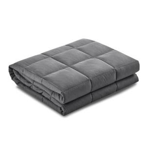 Folded grey weighted blanket on white background