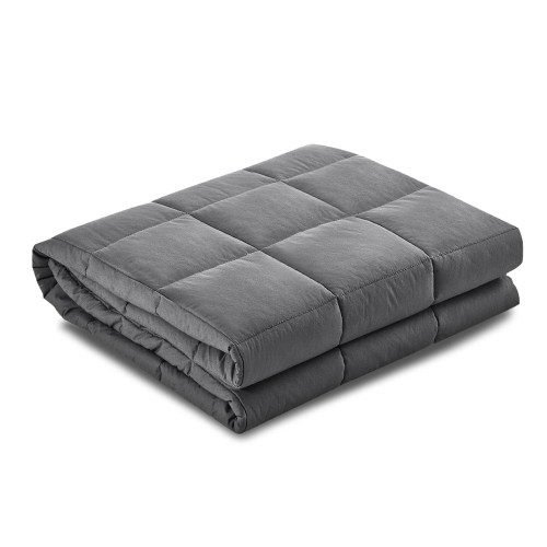 Folded grey weighted blanket on white background