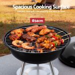 Charcoal kettle grill with assorted food cooking