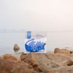 Tapioca cat litter bag on seaside rocks