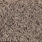 purrhaven tapioca clumping cat & kitty litter, 7.5kg (3 pack),dust free,easy to clean,odour neutraliser,rapid liquid absorption,non toxic formula Close-up of brown wood pellets pile