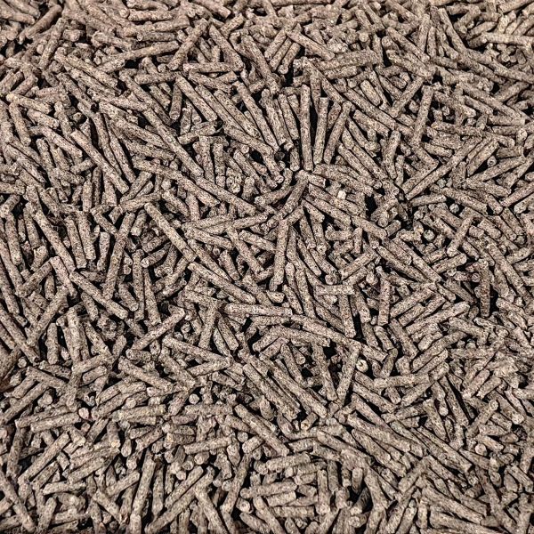 Close-up of brown wood pellets pile