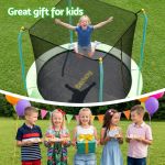 Child jumping on backyard trampoline at party