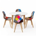 Round white table with colourful patchwork chairs