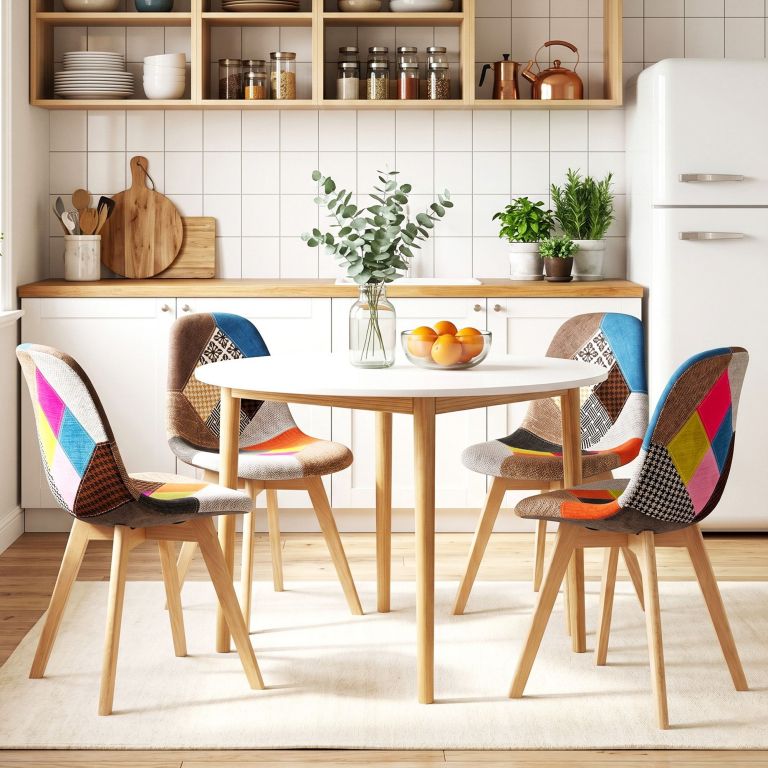 Modern kitchen with colourful chairs and round table