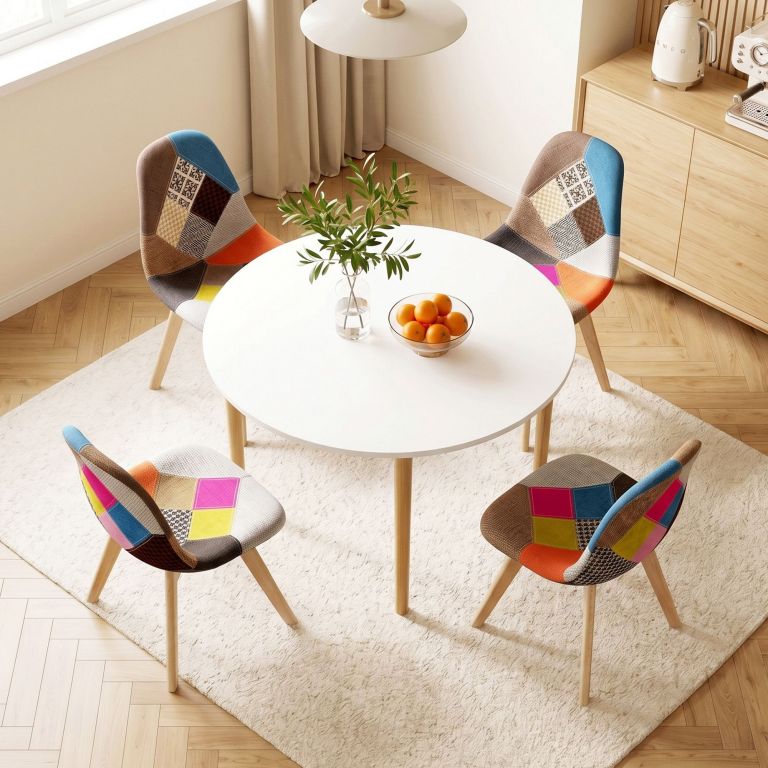 Round table with colourful patchwork dining chairs