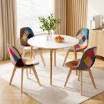 Round dining table with colourful patchwork chairs