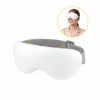 eye massage 03 cold wh 00.jpg Woman wearing white electronic eye massager mask