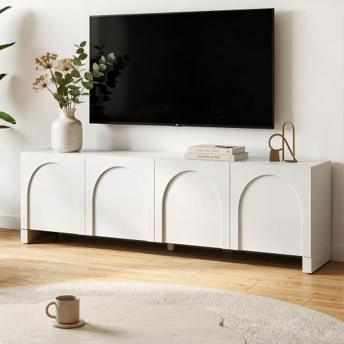 Wall-mounted TV above white minimalist sideboard