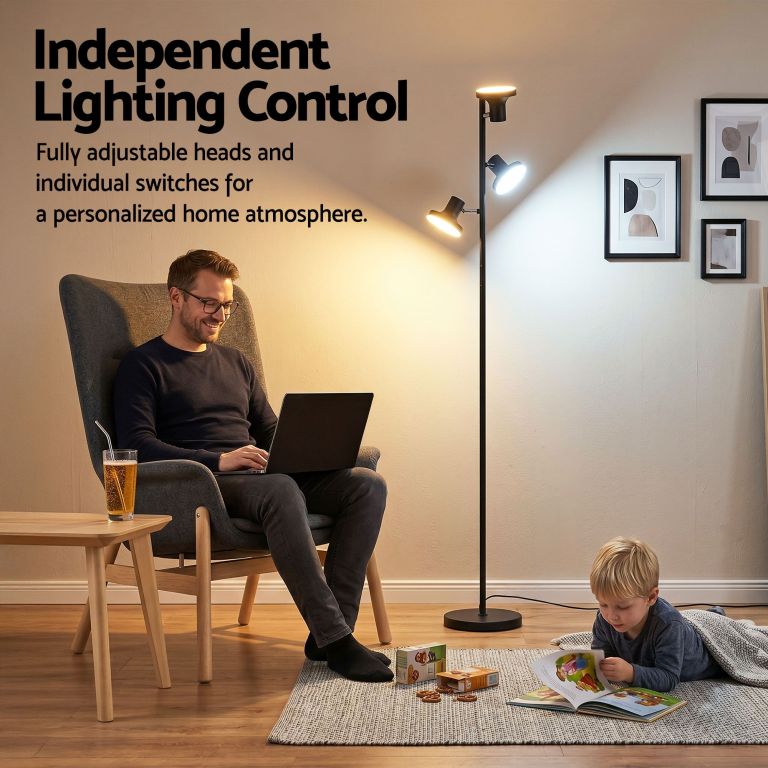 Man working beside adjustable floor lamp at home