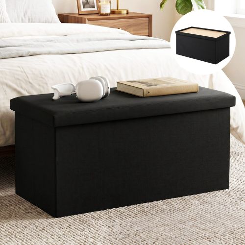Black storage ottoman bench at end of bed