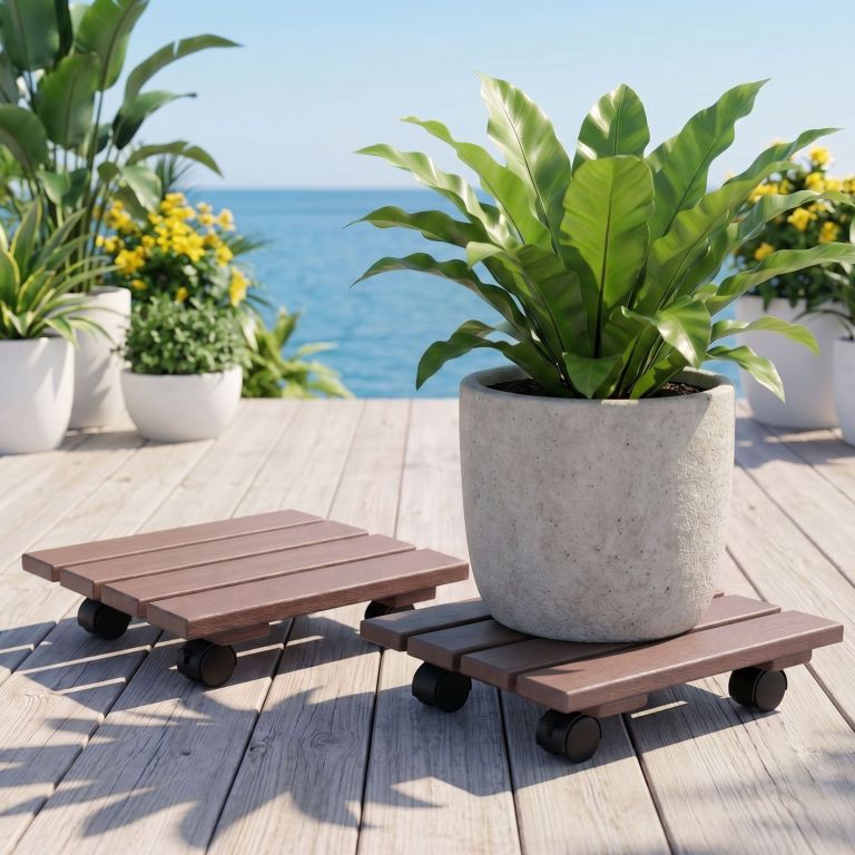 Potted plants on wheeled stands by ocean deck