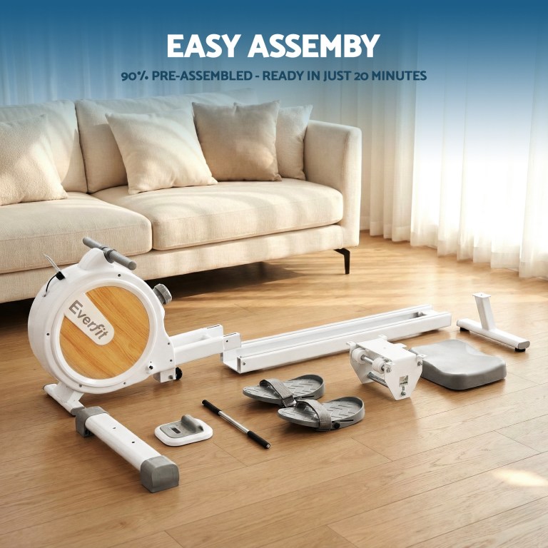 Partially assembled exercise machine in living room