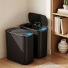 Black smart sensor rubbish bins in modern home