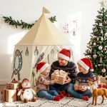 keezi kids play tent playhouse castle with window flag carry bag 115cmx115cm Father and children opening Christmas presents indoors