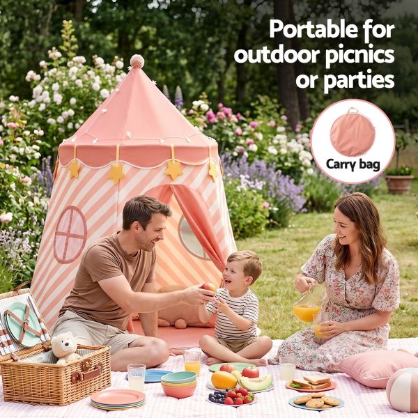 Family picnic beside pink portable kids tent
