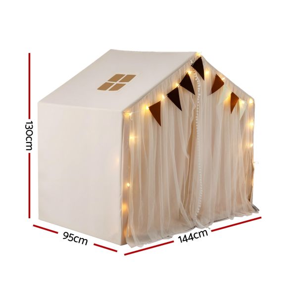 White house-shaped kids bed canopy with fairy lights