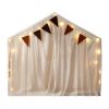 Sheer play tent with bunting and fairy lights