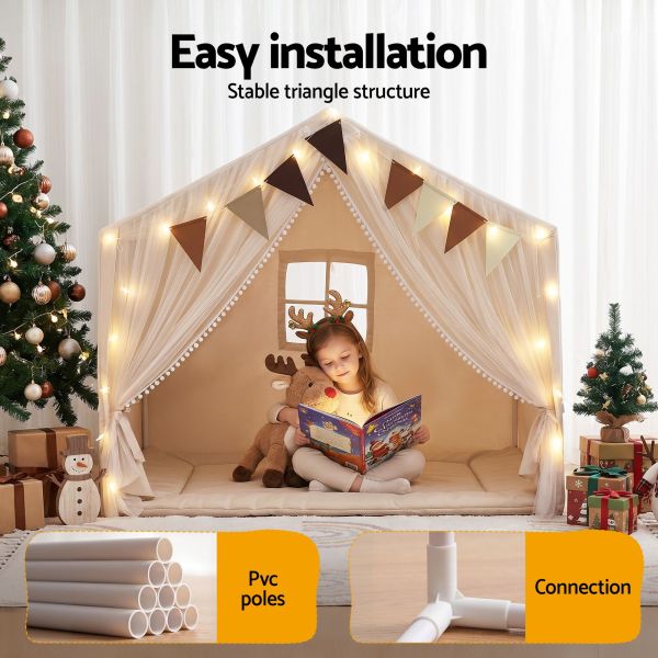 Child reading in festive indoor play tent