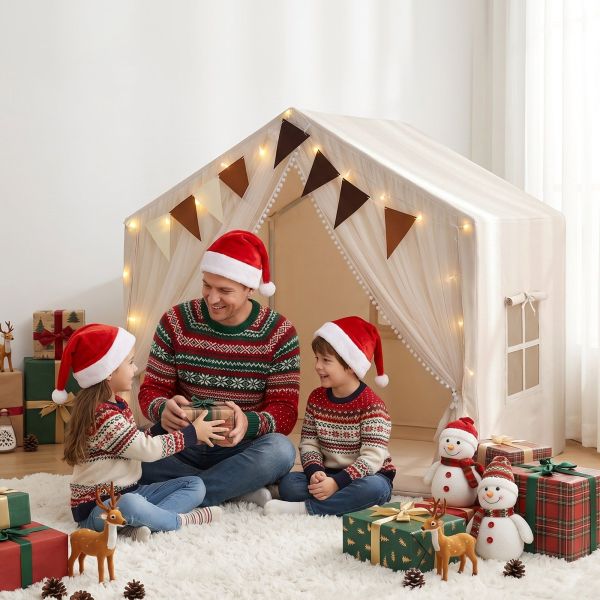 Family exchanging Christmas gifts in decorated indoor tent