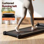 Person walking on cushioned home treadmill belt