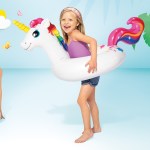 intex big animal rings 58221 Girl wearing unicorn pool float beside smiling woman