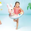 intex big animal rings 58221 Girl with llama pool float smiling indoors