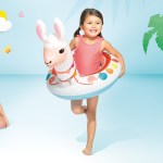 intex big animal rings 58221 Girl with llama pool float smiling indoors