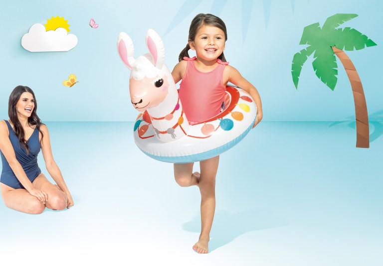 intex big animal rings 58221 Girl with llama pool float smiling indoors