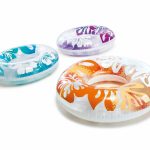 Three tropical patterned inflatable swim rings