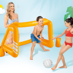 Children playing with inflatable goal and ball