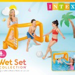 Kids playing with inflatable pool volleyball set