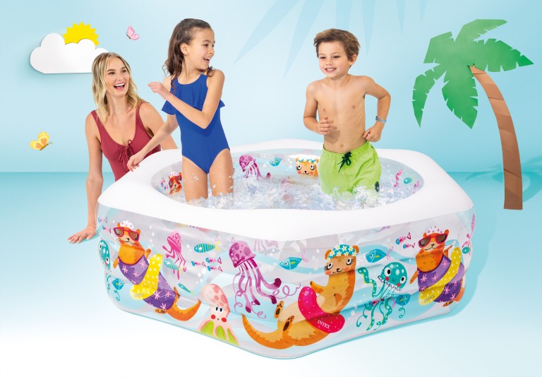 Children splashing in colourful inflatable backyard pool