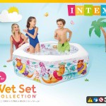 Kids playing in colourful inflatable backyard pool