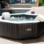Inflatable outdoor spa beside swimming pool