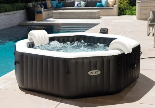 Inflatable outdoor spa beside swimming pool