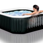 Woman relaxing in inflatable spa with bubbles