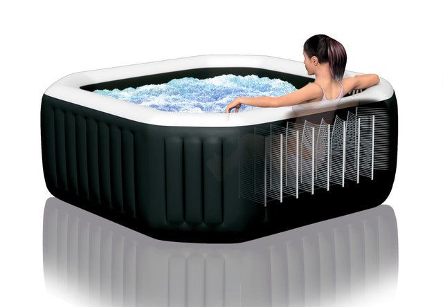 Woman relaxing in inflatable spa with bubbles