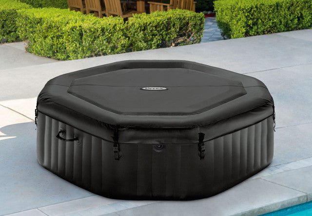 Black inflatable outdoor spa with fitted cover
