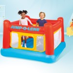 intex jump o lene inflatable bouncer play house 48260 Two children playing in inflatable bounce house indoors