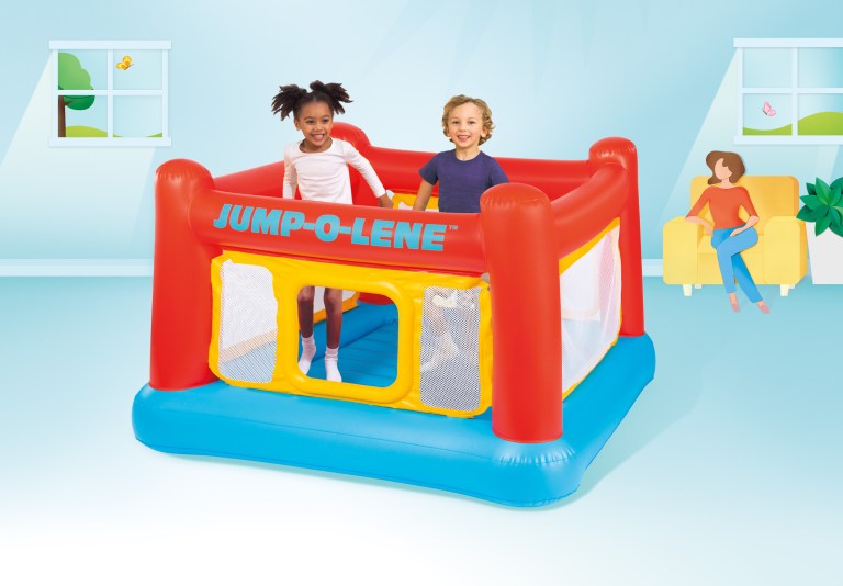 intex jump o lene inflatable bouncer play house 48260 Two children playing in inflatable bounce house indoors