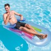 intex king kool inflatable pool lounge 58802 Man relaxing on inflatable pool float with water bottle