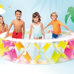 Family enjoying colourful inflatable backyard pool