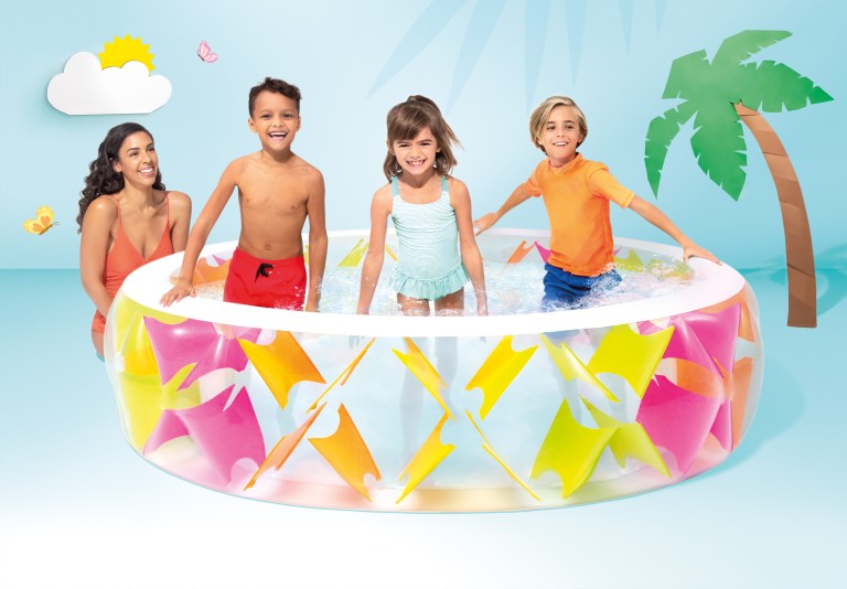 Family enjoying colourful inflatable backyard pool