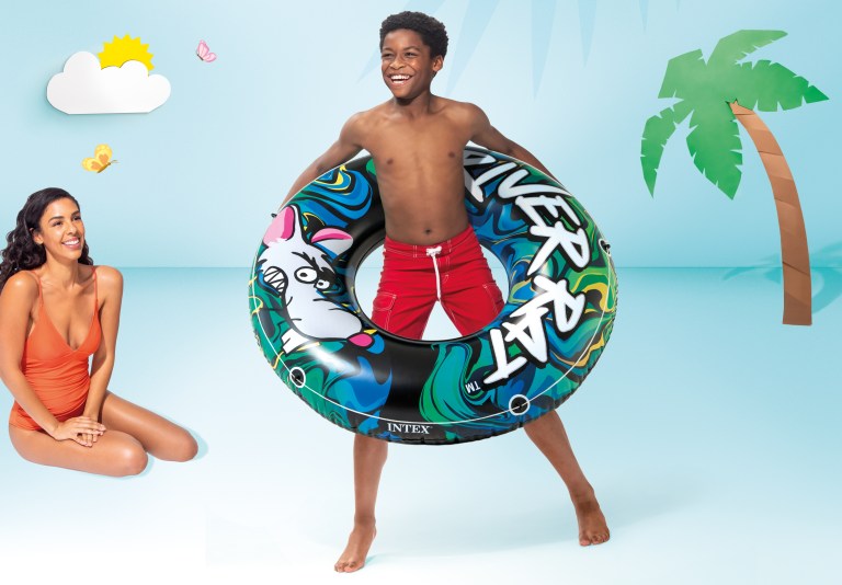 intex river rat swim tube pool float 68209 Boy with inflatable swim ring and smiling woman