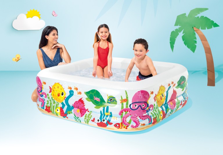 Children playing in colourful inflatable backyard pool