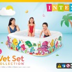 Children playing in colourful inflatable backyard pool