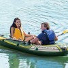 intex seahawk 2 boat set 68347 Couple kayaking on calm lake in inflatable boat